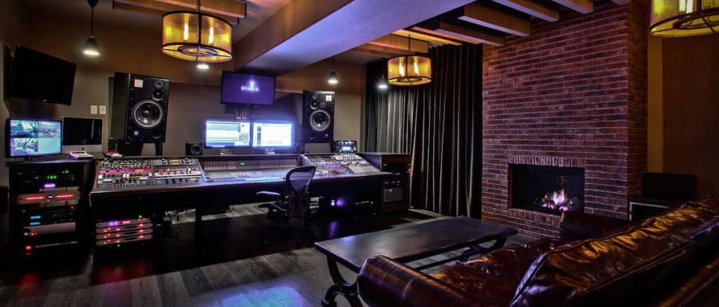 an elaborate home studio with console and outboard